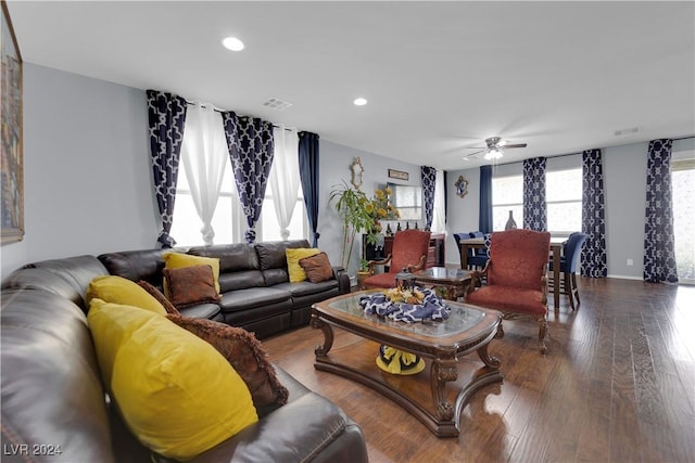 living room with hardwood / wood-style flooring and ceiling fan