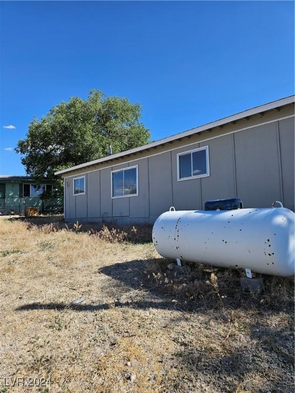 310 Arizona St, Tonopah, NV 89049 - view of side of home with board and batten siding