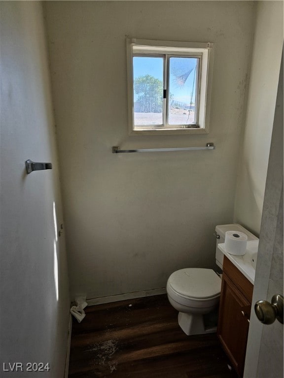 bathroom featuring hardwood / wood-style floors, vanity, and toilet