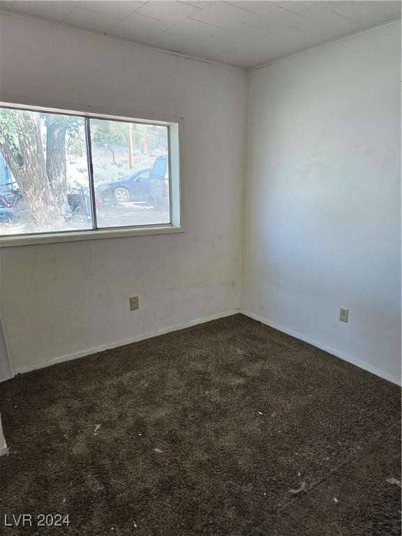 310 Arizona St, Tonopah, NV 89049 - unfurnished room featuring carpet and baseboards
