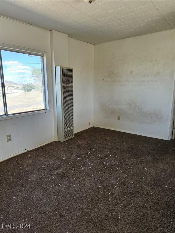310 Arizona St, Tonopah, NV 89049 - carpeted spare room featuring a heating unit