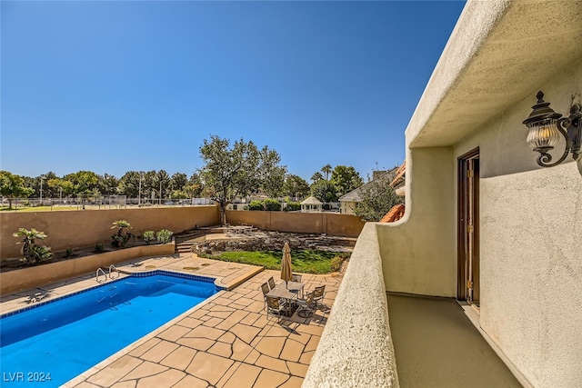 view of pool with a patio area