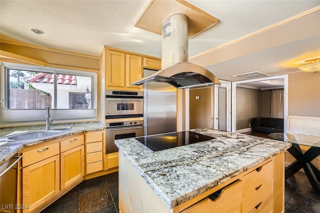 kitchen featuring sink, island range hood, a kitchen island, light brown cabinets, and appliances with stainless steel finishes