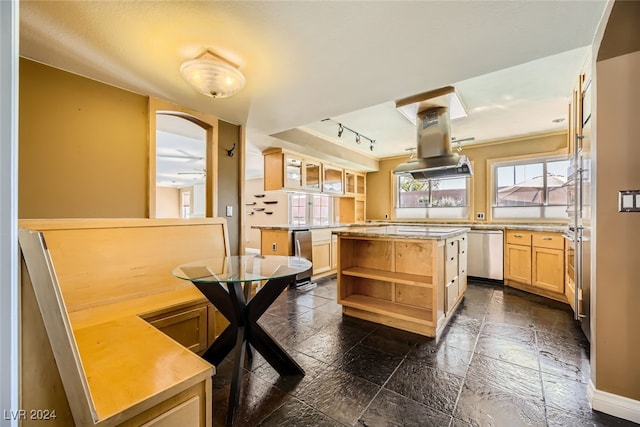 kitchen with stainless steel dishwasher, a kitchen island, island exhaust hood, rail lighting, and light brown cabinetry