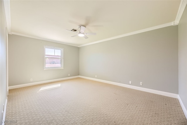 empty room with crown molding, ceiling fan, and light colored carpet