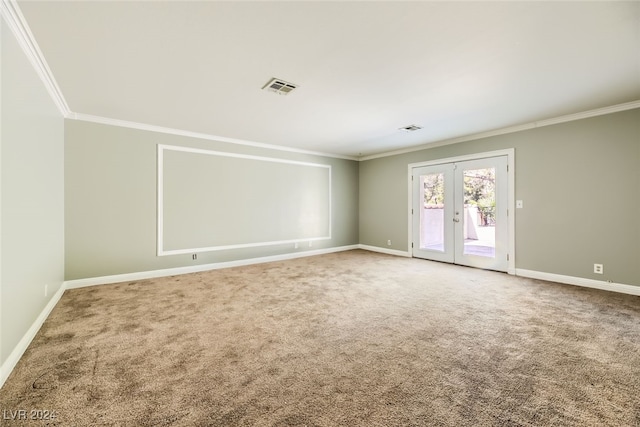 empty room with carpet flooring, french doors, and crown molding