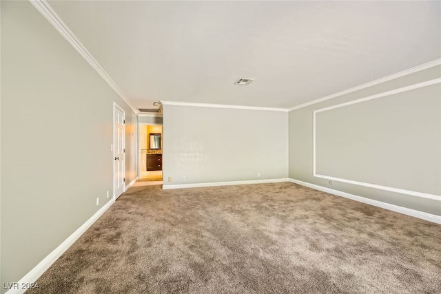 carpeted spare room with ornamental molding