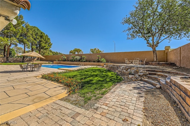 view of pool featuring a patio