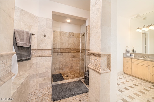 bathroom featuring vanity and a tile shower