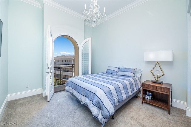 carpeted bedroom featuring an inviting chandelier and crown molding