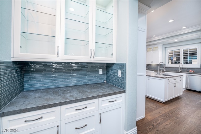 kitchen featuring white cabinets, dark hardwood / wood-style floors, tasteful backsplash, and sink