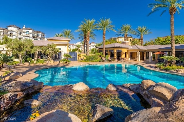 view of swimming pool featuring a patio area