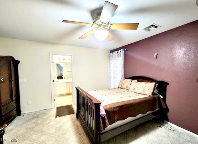 bedroom featuring ceiling fan and ensuite bathroom