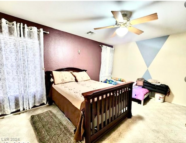 bedroom featuring ceiling fan and light colored carpet