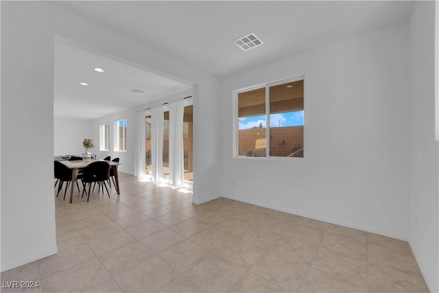 interior space with baseboards, visible vents, and recessed lighting