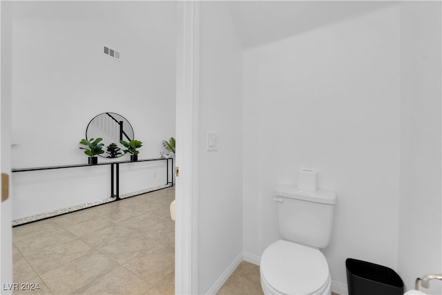 bathroom featuring toilet and tile patterned floors