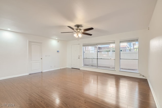 empty room featuring ceiling fan and hardwood / wood-style flooring