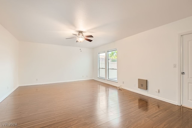 unfurnished room with wood-type flooring and ceiling fan