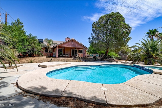 view of swimming pool with a patio