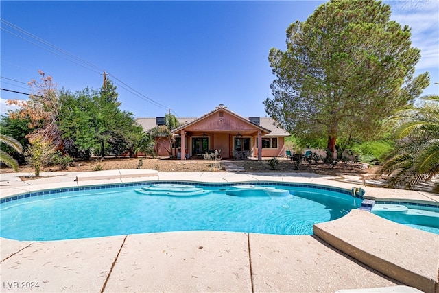 view of swimming pool featuring a patio area