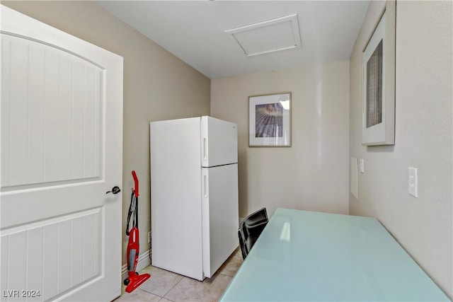 kitchen featuring light tile patterned floors and white refrigerator