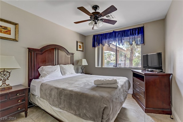 bedroom featuring ceiling fan and light tile patterned floors