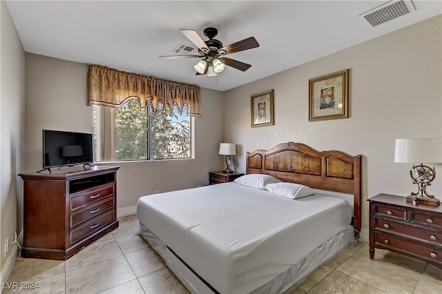 bedroom featuring light tile patterned floors and ceiling fan