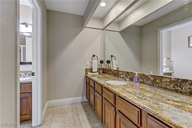 bathroom featuring vanity and tile patterned flooring