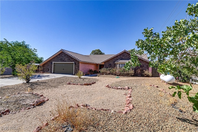 single story home with a garage