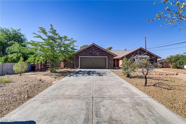 single story home featuring a garage