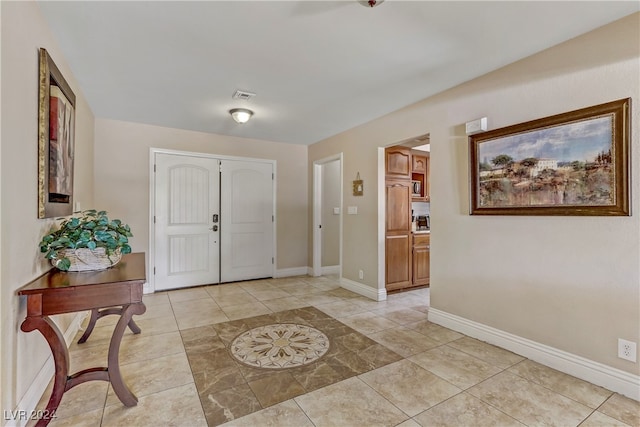 foyer with light tile patterned flooring