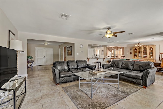 living room featuring ceiling fan and light tile patterned floors