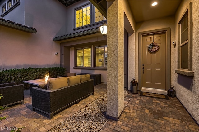 view of patio / terrace with an outdoor living space with a fire pit