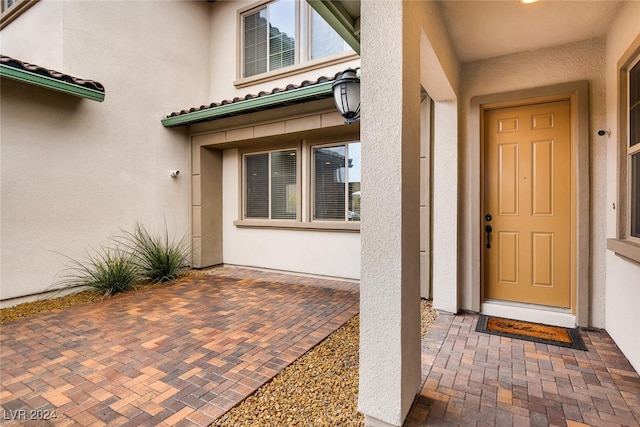 property entrance with a patio area