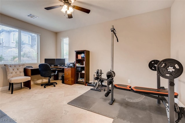 interior space featuring ceiling fan and light tile patterned floors