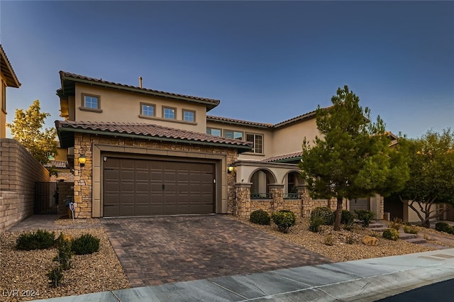 mediterranean / spanish-style house featuring a garage