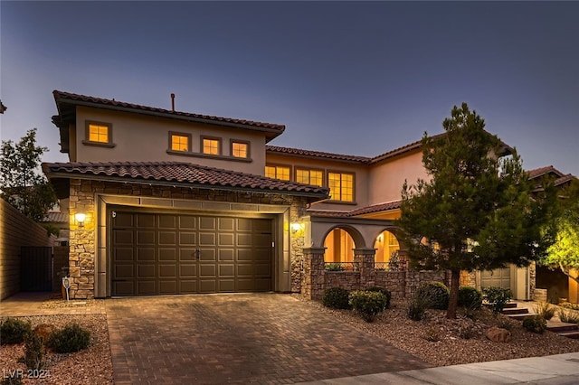 mediterranean / spanish-style house featuring a garage