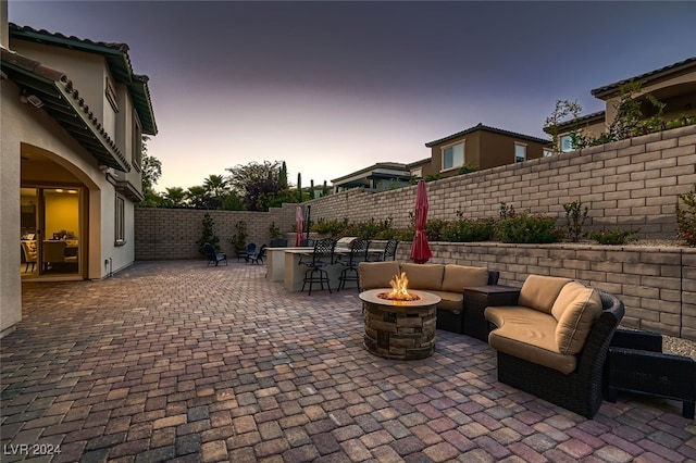 patio terrace at dusk with a fire pit