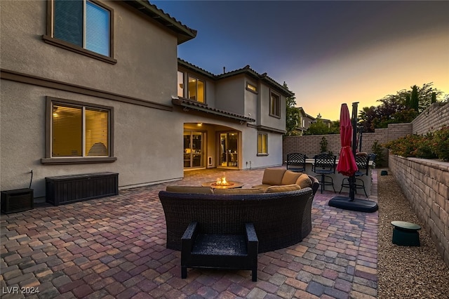 patio terrace at dusk with a fire pit