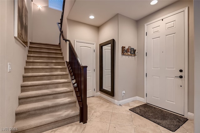 foyer entrance featuring light tile patterned floors