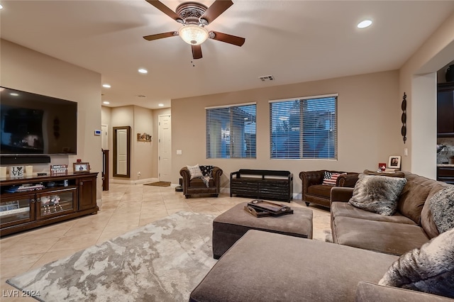 tiled living room featuring ceiling fan