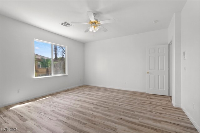 unfurnished room featuring ceiling fan and light hardwood / wood-style flooring