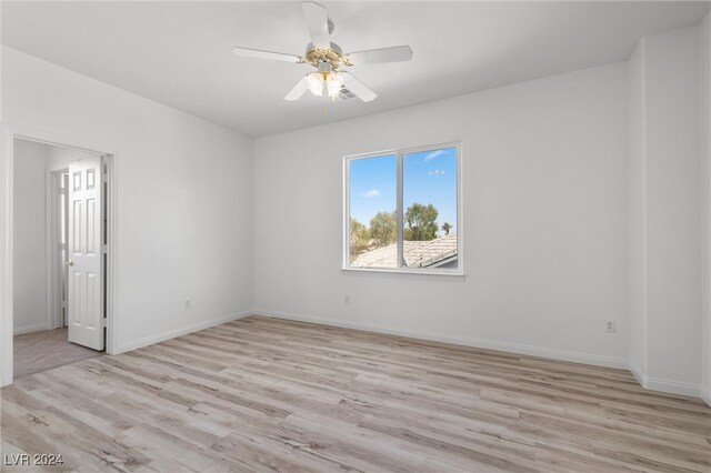 unfurnished room featuring ceiling fan and light hardwood / wood-style floors