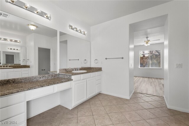 bathroom featuring tile patterned floors, ceiling fan, and vanity