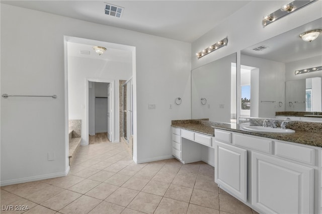 bathroom featuring tile patterned flooring and vanity