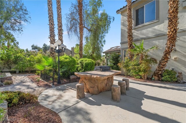 view of patio featuring an outdoor fire pit