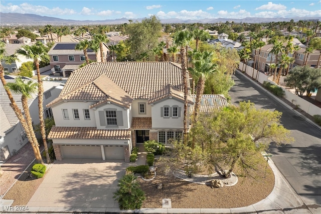 birds eye view of property featuring a mountain view