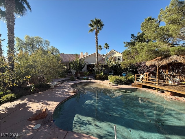 view of swimming pool featuring a deck