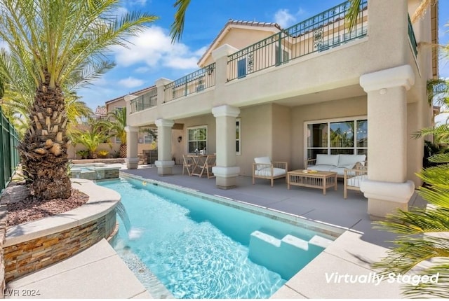 view of swimming pool featuring an in ground hot tub, a patio, and an outdoor living space