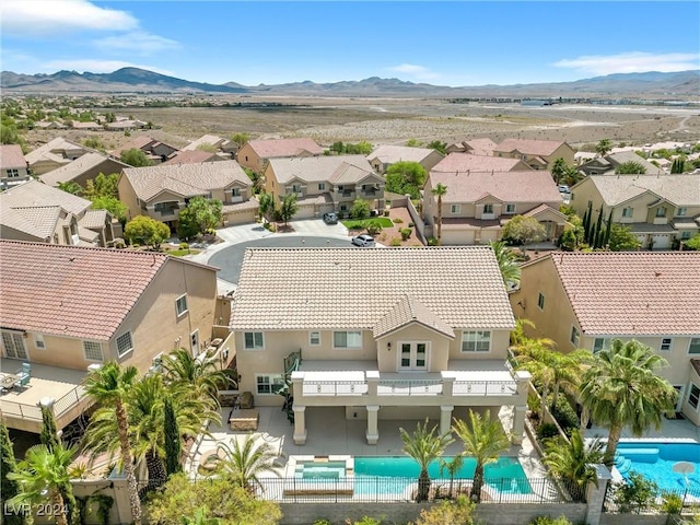 birds eye view of property featuring a mountain view